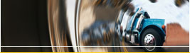 Freight truck reflected in a chrome wheel cap of a freight truck